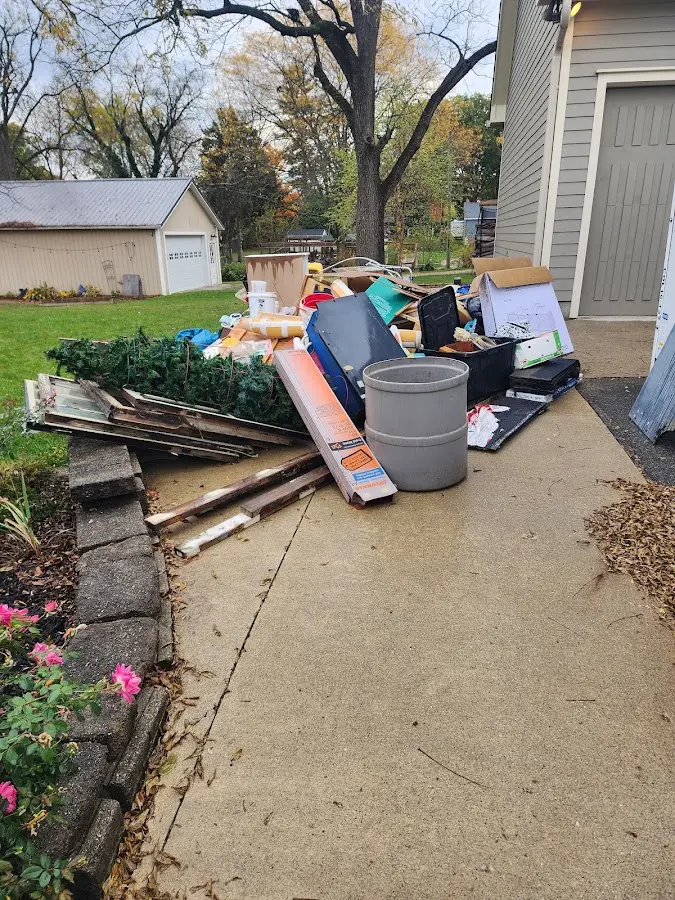 Dumpster being loaded with debris for 12 Yard Dumpster Rental in Coventry